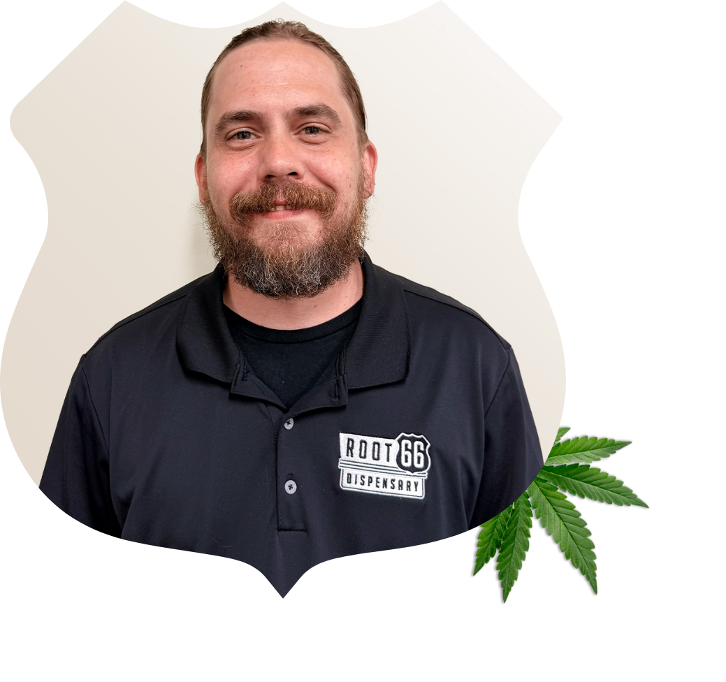 Portrait of Mike Carroll, store manager at Root 66 Dispensary Des Peres. He has brown hair. A cannabis leaf is in the bottom corner of the image.